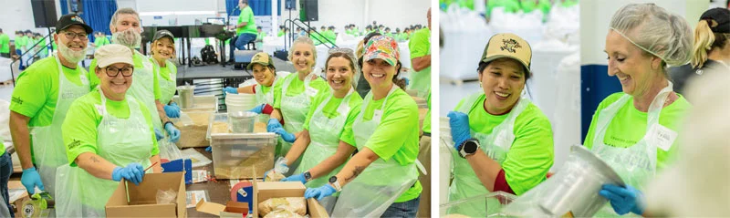 volunteers smiling while filling boxes with donations