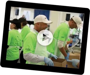 Click to watch 4imprint video about hundreds of helpers doing their part to support neighbors in need