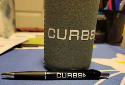 custom can coolers to be handed out at trade show events