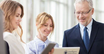 group of business people looking at a computer