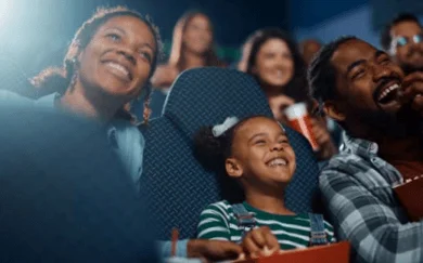 Columbia Basin Hospital hosts a holiday-movie night - picture of family at movie theatre