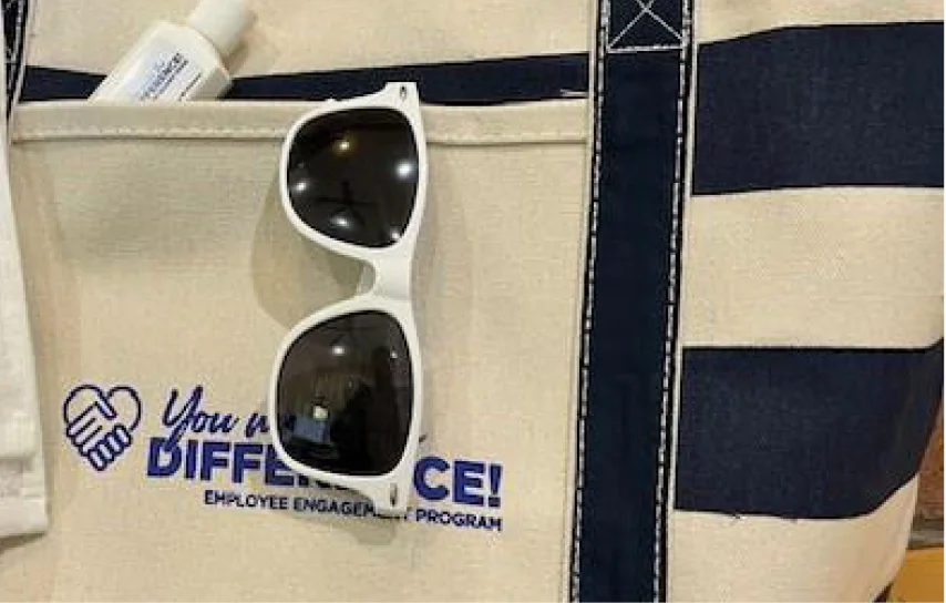 sunglasses hanging on a swag bag