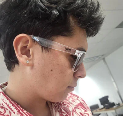 person wearing logoed sunglasses