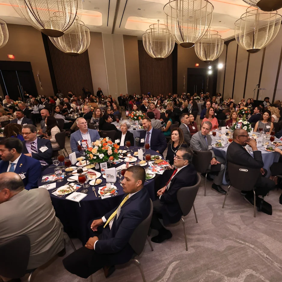 room of people at an annual luncheon fundraiser