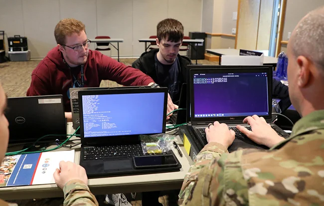 Participants in a workshop at BloomCon - a cybersecurity conference