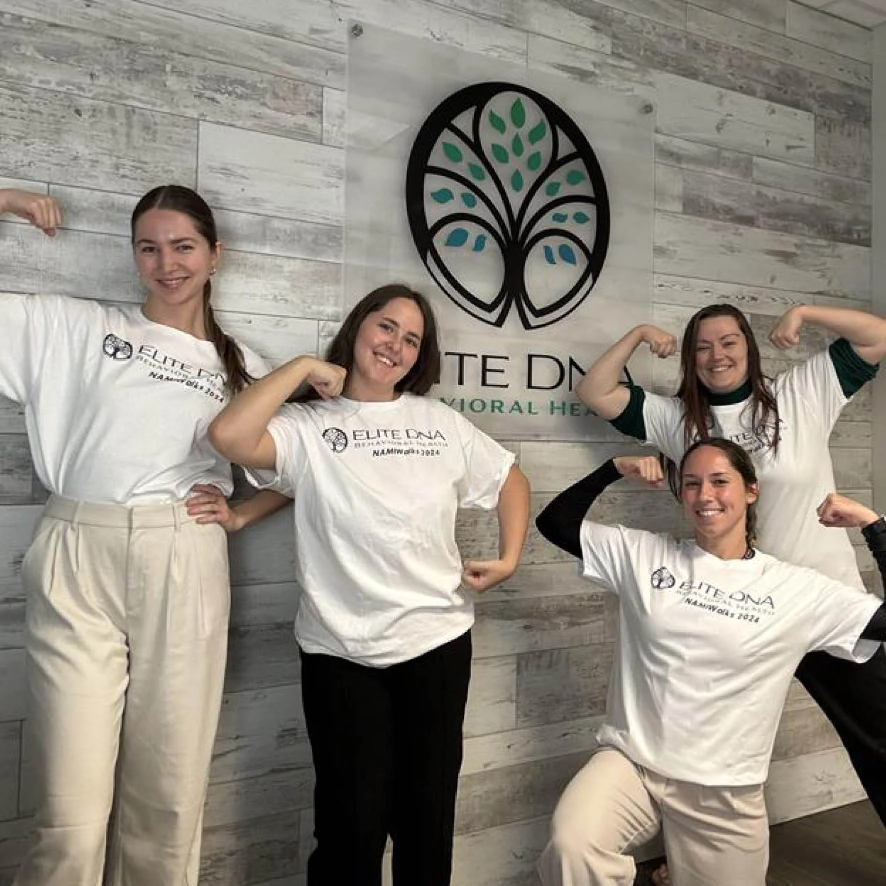 group of people wearing namiwalks team shirts