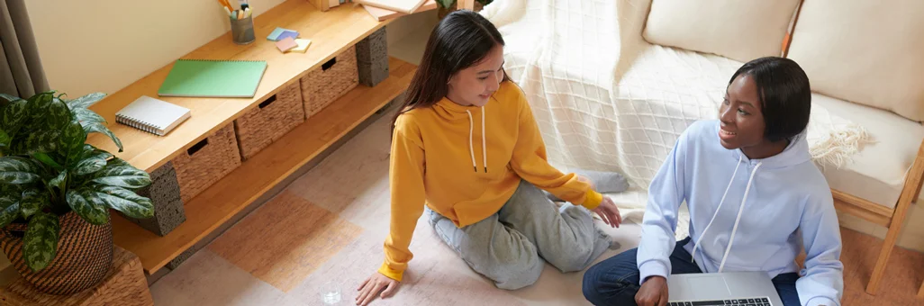 two people talking in living room of apartment