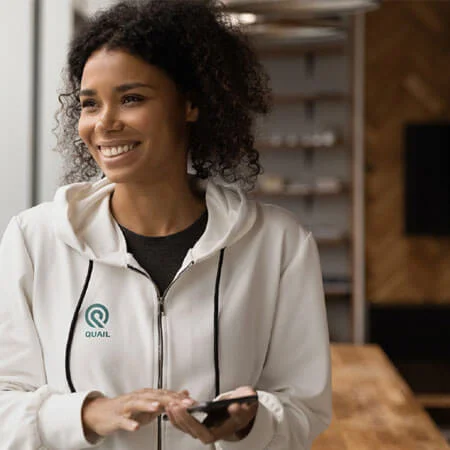 employee wearing promotional hoodie at work