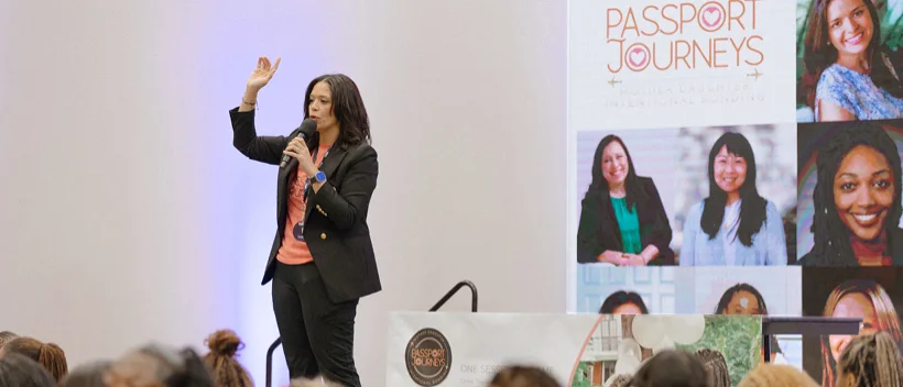 A person from passport journeys speaking into a microphone