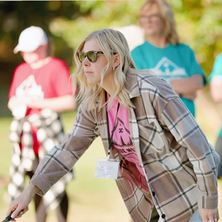 A person holding a golf club
