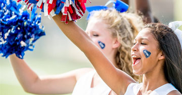 cheerleaders cheering with pom poms