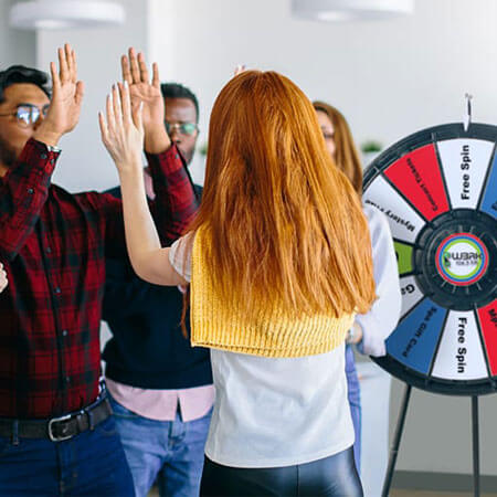 group of people with a spin wheel