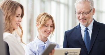 group of business people looking at a computer