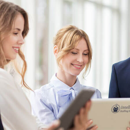 group of business people looking at a computer