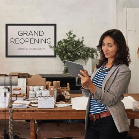 person on a tablet at a grand opening