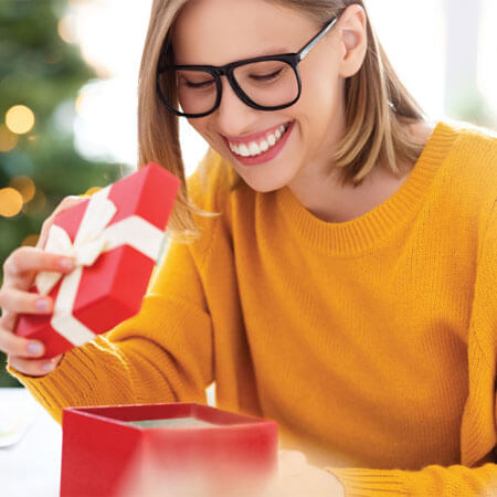 person opening a gift box