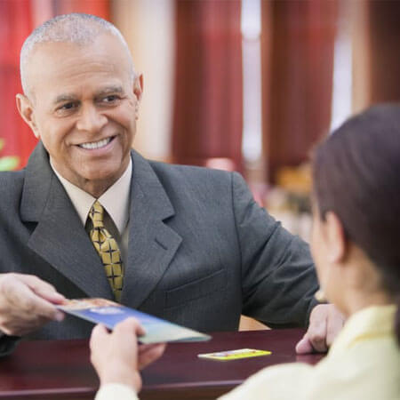 two people exchanging a document