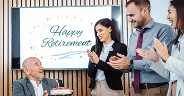 group of people celebrating a man's retirement in an office