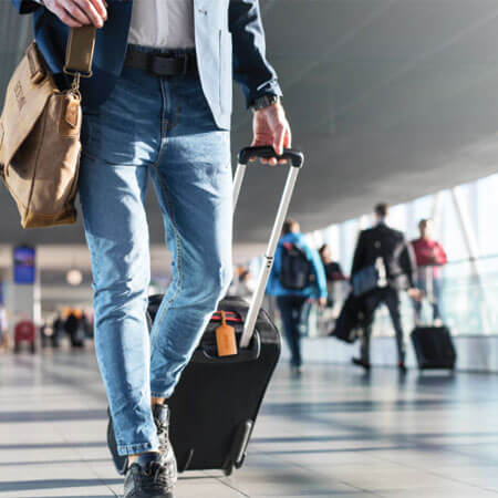 person pulling a piece of luggage