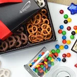Food and candy promotional products that include a logoed box of pretzels and candy