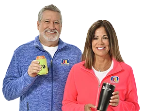 Daryl and Denise wearing and holding Crossland branded products