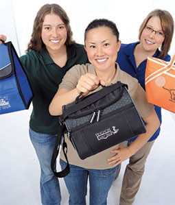 3 Models Holding Bags